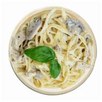 El Fredo · Fettuccini pasta, Alfredo sauce, Parmesan cheese, chicken, mushrooms, & roasted garlic.
