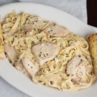 Fettuccine Alfredo with Chicken · Alfredo sauce, fresh parsley and a touch of Parmesan.