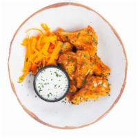 Sweet Heat Wings · Wings roasted to perfection and tossed with hot sauce, butter and brown sugar. Served with a...