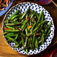 71. Sauteed String Bean Szechuan Style · With steamed rice. Hot and spicy.