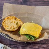 Herb Biscuit Sandwich · on Splithouse sausage and herb biscuit, smoked provolone cheese, bacon, fresh greens, tomato...