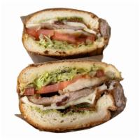 Pesto Chicken Club Specialty Roll · Grilled chicken, bacon, lettuce, tomato, pesto, melted swiss cheese on a French roll.