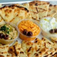 Pita and Dip - Sampler · (4) Grilled pita bread with choice of THREE house-made spreads. Vegetarian.