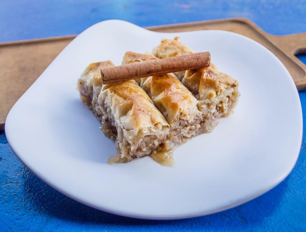 Baklava Bites · Walnut mixture wrapped in phyllo dough, soaked in honey and cinnamon syrup.