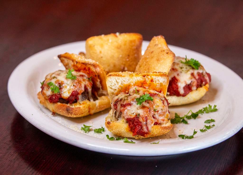 Meatball Sliders · Four sliders topped with marinara sauce, melted mozzarella and basil. Baked on our own passion bread.