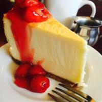 New York Cheesecake · Graham cracker crust and cream cheese filling. Add cherry toppings for an additional charge.