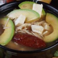 Caldo de Pollo · Chicken broth, chicken, carrots, cabbage, zucchini and potatoes. Served with rice and flour ...