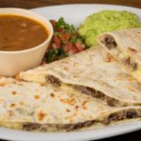 Quesadilla Grande · Large flour tortilla, white melted cheese, with your choice of meat: beef steak, trompo styl...