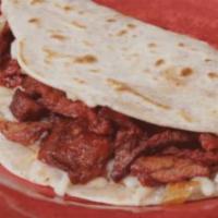 Gringa Taco · Flour tortilla, white melted cheese with your choice of meat: beef steak, trompo style pork ...
