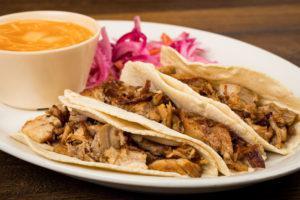 Tacos de Carnitas · 3 corn tortillas, shredded braised pork, spicy pickled red onions and Mexican fideo soup.