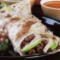 Pirata Gigante Burrito · Chopped beef steak, avocado, white melted cheese, grilled onions in a huge flour tortilla, p...