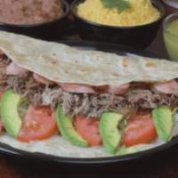 Burrito Monterrey · Giant flour tortilla, shredded beef, sliced weenies, avocado, cream, refried beans, lettuce ...