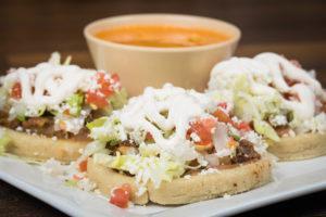 Sopes Plate · Includes your choice of meat: picadillo, chicharron or deshebrada, refried beans, queso fres...