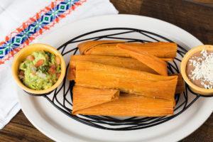 Tamales Plate · 6 pork or cheese tamales, guacamole and refried beans.