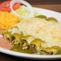 Enchiladas Suizas · 5 chicken enchiladas, poblano green salsa, white melted cheese, rice and refried beans.