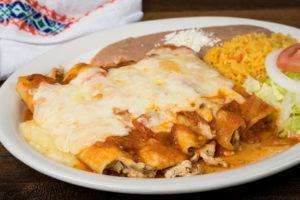 Enchiladas Chicken Rancheras · 5 chicken enchiladas, ranchera salsa, white melted cheese, rice and refried beans.
