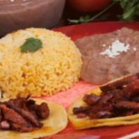 Kids Taquitos de Trompo Jr. · 2 small marinated pork tacos, rice and refried beans.