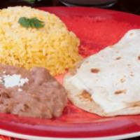 Kids Quesadilla Jr. · Flour tortilla filled with white melted cheese, rice and refried beans.