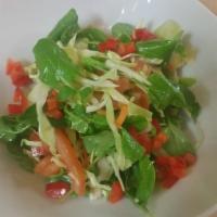 Arugula Salad · Baby arugula, cherry tomatoes, Parmesan cheese, lemon dressing.