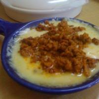 Queso Fundido · Melted cheese with Mexican sausage or beans.