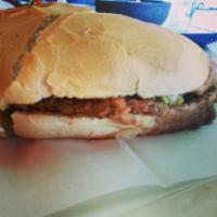 Res Torta · Seasoned beef. With a refried bean base, lettuce, tomato, onion, avocado and sour cream.