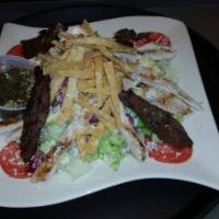 Jacalito's House Salad · Lettuce, tomato, cucumber, red onion, corn and avocado. With fried tortilla strips & house d...