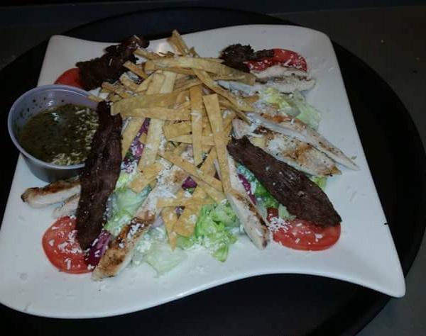 Jacalito's House Salad · Lettuce, tomato, cucumber, red onion, corn and avocado. With fried tortilla strips & house dressing.