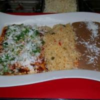 Chicken Enchilada · 3 corn tortillas rolled and stuffed with chicken. Covered in red or green (spicy) sauce, mel...