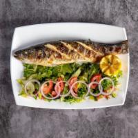 Grilled Branzino  · Char grilled  whole Branzino served with a green salad 