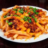 Chili & Cheese Fries · Homemade chili and shredded cheddar.