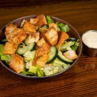 Side House Salad · 50/50 lettuce mix, tomatoes, onions, cucumbers, shredded cheese, fresh baked croutons and yo...