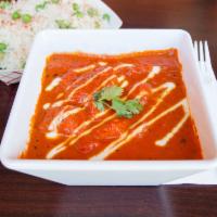Chicken Tikka Masala · All-time favorite, chicken marinated in yogurt cooked in rich tomato sauce. Served with basm...