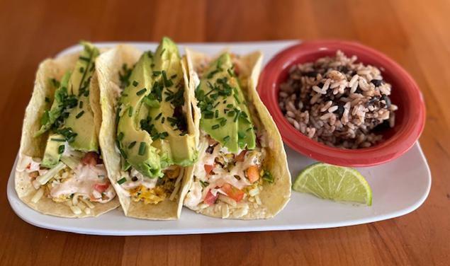Breakfast Tacos (Veg) · 3 grilled flour tortillas filled with a scramble of eggs, pico de gallo, pepperjack cheese, chipotle sour cream and avocado, served with a side of black beans and rice