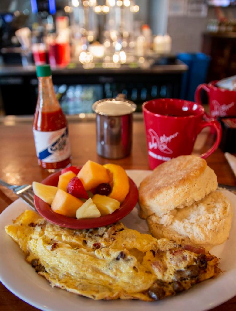 Three Little Pigs Omelet · Applewood-smoked bacon, ham, pork sausage and swiss cheese omelet, served with choice of side and bread