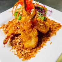 4 Piece Coconut Prawns · Panko king prawn, coconut batter, roasted coconut flakes with sweet and sour sauce.