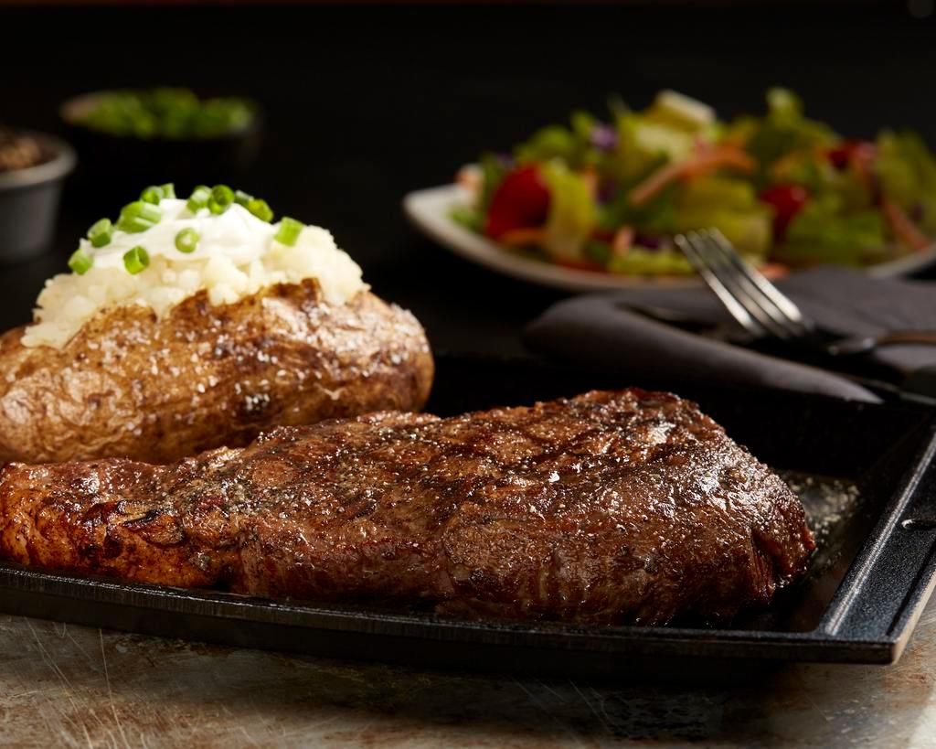 14 oz. Rib Eye Steak · Well-marbled, tender, juicy and delicious. Includes choice of side.