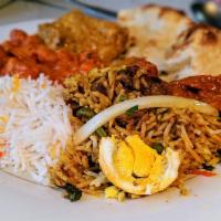 Chicken Biriyani with Bone · Served with raita and egg.  Biryani is an all-time favorite Bangladeshi dish made with meat ...