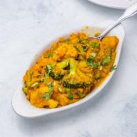 Mixed Vegetable with Lentils · Mixed vegetable and lentils cooked with turmeric, ginger, onion, and topped with roasted gar...