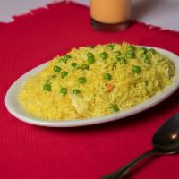 Peas Polao · Baash-moti rice prepared with green peas, grilled onion, turmeric and other spices.