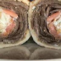 Gyros · Authentic Greek Gyro topped with our homemade tzatziki sauce, tomatoes, onions, and french f...