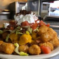 Loaded Tater Tots · Tater Tots with cheese, bacon, lettuce, tomato, and sour cream