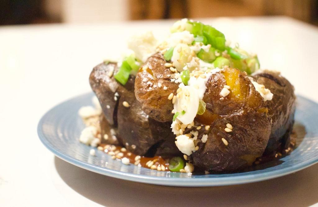 Smoked Potatoes Mole · Oaxacan Chocolate Mole, Queso Fresco, Sesame Seed, Scallion.