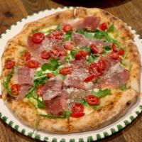 Tartufata Pizza · Italian truffle oil, cherry tomatoes, arugula, Parmigiano-Reggiano and prosciutto di Parma, ...
