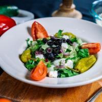 Insalate Al Forno · Mixed greens with feta cheese, cucumbers, black olives, onions, tomato and pepperoncini.