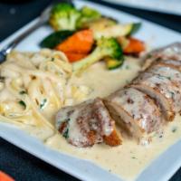 Chicken Cordon Bleu · Chicken breast stuffed with mixed cheese and prosciutto, topped with white wine cream sauce
