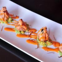 Spicy Tuna Dumpling · Deep fried spicy tuna wrapped in wonton pastry on a bed of mixed minced avocado and mango, t...