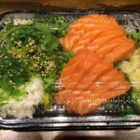 Sake Don · Salmon sashimi over a bed of seasoned sush rice with seaweed salad and oshinko. Served with ...