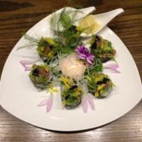 NYK Roll · Kani, cucumber and avocado inside topped with chopped tuna, mango and seaweed salad with che...