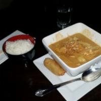 Massaman Curry · Sweet mild curry with coconut milk, onions and potatoes for a rich creamy taste. Served with...