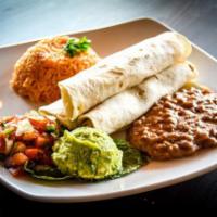 Tacos al Carbon · Your choice of three grilled skirt steak or ribeye tacos, served with spanish rice, beans, g...